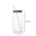 Clear glass with a bamboo lid and clear reusable straw